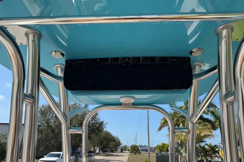 Slide: The Image of 2025 Key West 219 FS boat dashboard with steering wheel and controls. - 30