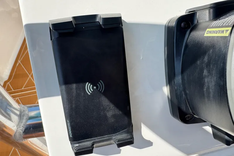Slide: The Image of Wireless charging pad on 2025 Key West 219 FS boat dashboard. - 34