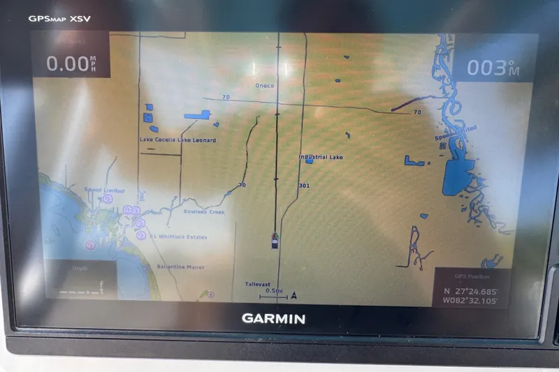 Slide: The Image of Garmin GPS display on Key West 219 FS boat, showing map and coordinates. - 43