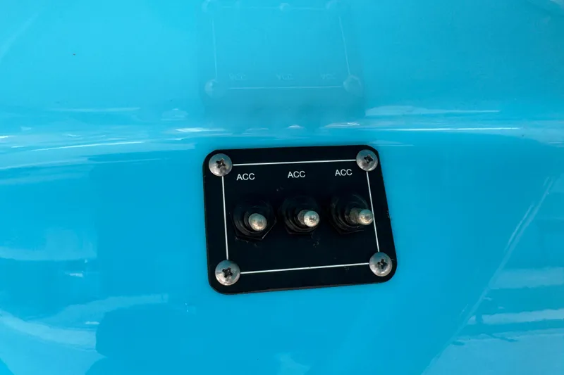 Slide: The Image of Control panel with three switches on a 2025 Key West 219 FS boat. - 48