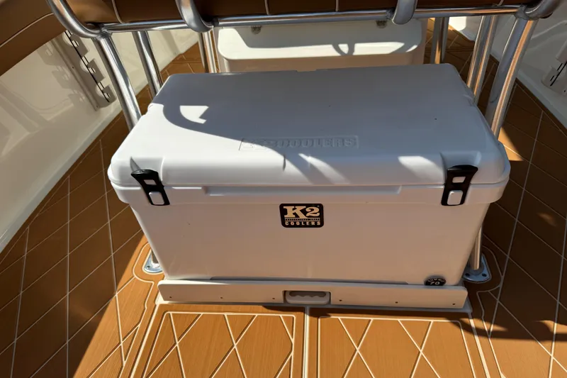 Slide: The Image of White K2 cooler on 2025 Key West 219 FS boat with brown deck flooring. - 63
