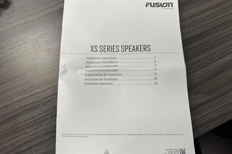 Slide: The Image of Instruction manual for Fusion XS Series Speakers on a wooden table. - 73
