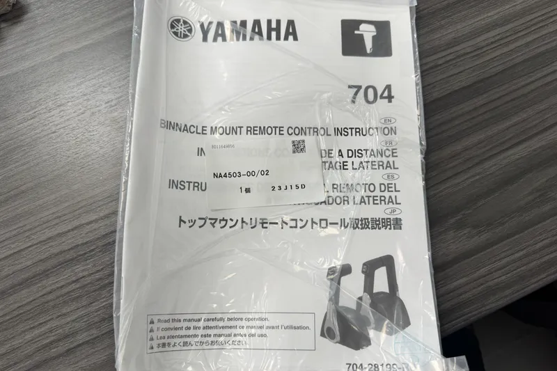 Slide: The Image of Yamaha remote control instructions on a table, related to Key West 219 FS, 2025 model. - 77