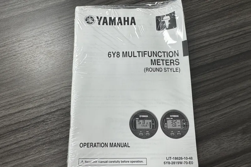 Slide: The Image of Yamaha remote control instructions on a table, related to Key West 219 FS, 2025 model. - 79