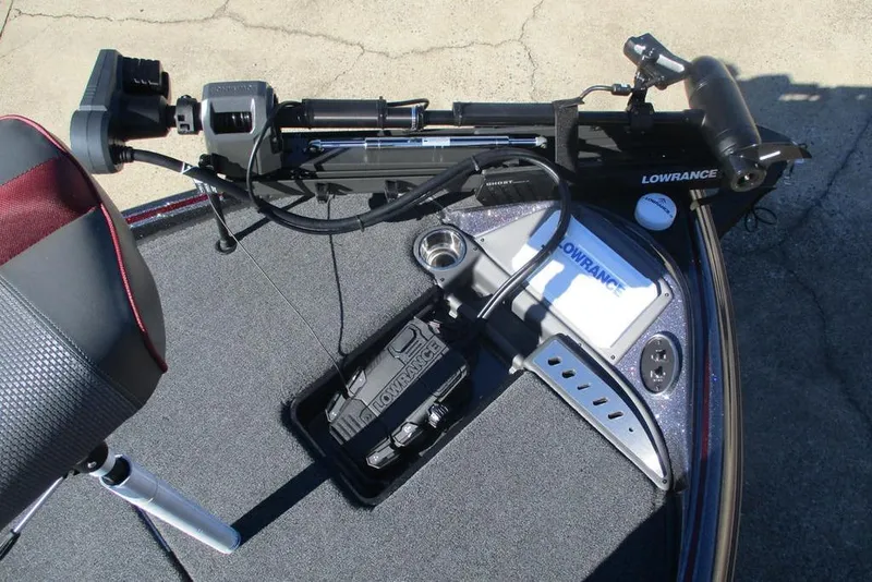 Slide: The Image of 2025 Triton 19 TrX Patriot boat deck with Lowrance equipment and seating. - 4