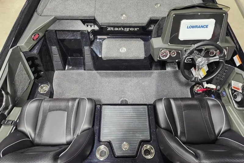 Slide: The Image of 2014 Ranger Z518 Cup-Equipped boat interior with steering wheel and Lowrance display. - 10