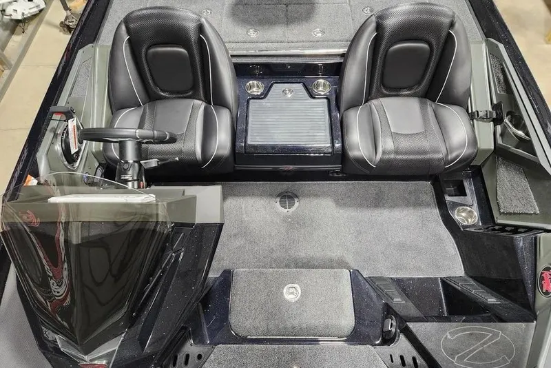 Slide: The Image of 2014 Ranger Z518 Cup-Equipped boat interior with dual seats and steering console. - 11