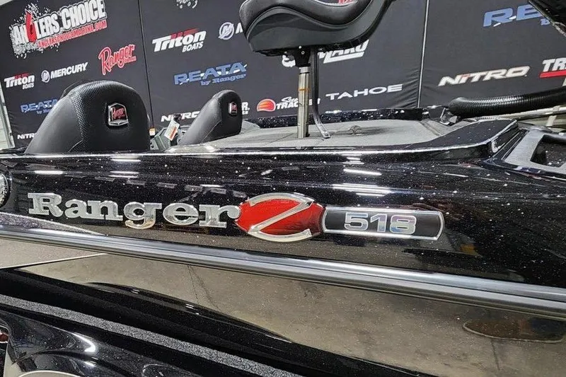 Slide: The Image of 2014 Ranger Z518 Cup-Equipped boat at a promotional event with branded backdrop. - 13