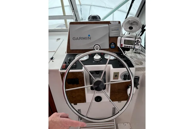 Slide: The Image of 2006 Back Cove 29 helm with Garmin navigation system and steering wheel. - 3