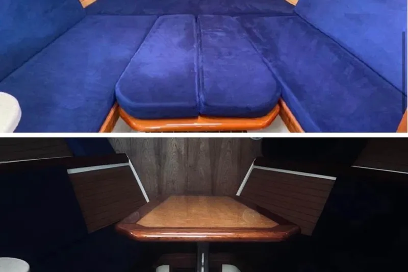 Slide: The Image of 2006 Back Cove 29 interior with blue seating and wooden table. - 6