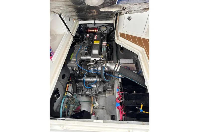 Slide: The Image of Engine compartment of a 2006 Back Cove 29 boat, showcasing detailed mechanical components. - 9