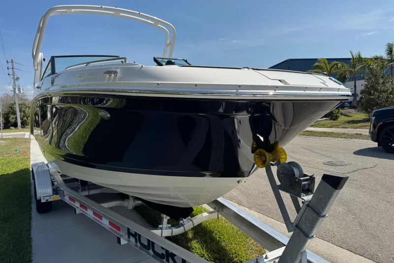Slide: The Image of 2019 Sea Ray SDX 270 Outboard boat on trailer, parked outdoors. - 13