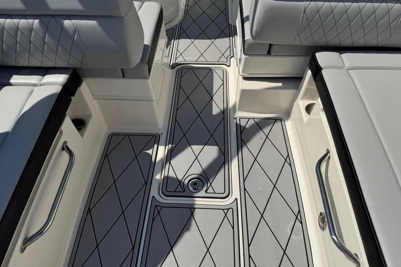 Slide: The Image of 2019 Sea Ray SDX 270 Outboard interior with diamond-stitched seating and non-slip flooring. - 23