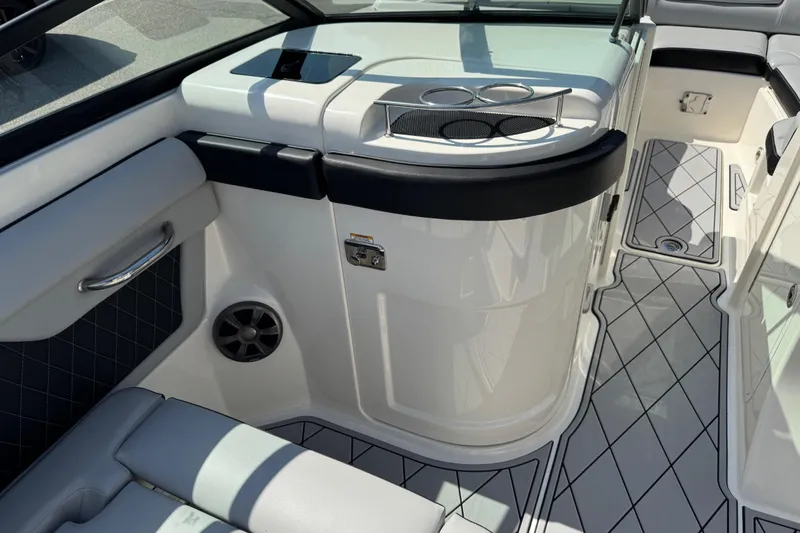 Slide: The Image of 2019 Sea Ray SDX 270 Outboard interior with seating and cup holders. - 24