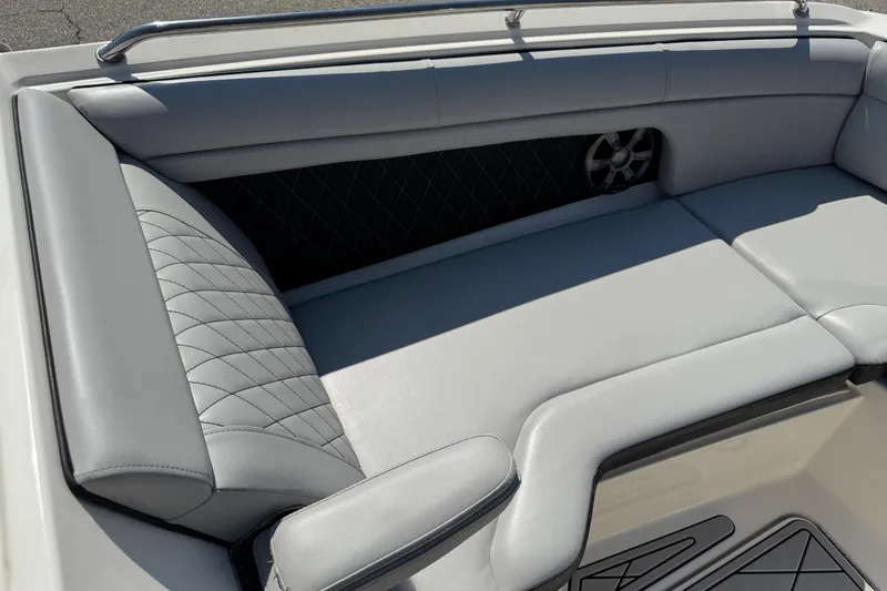 Slide: The Image of 2019 Sea Ray SDX 270 Outboard boat interior with gray cushioned seating. - 28