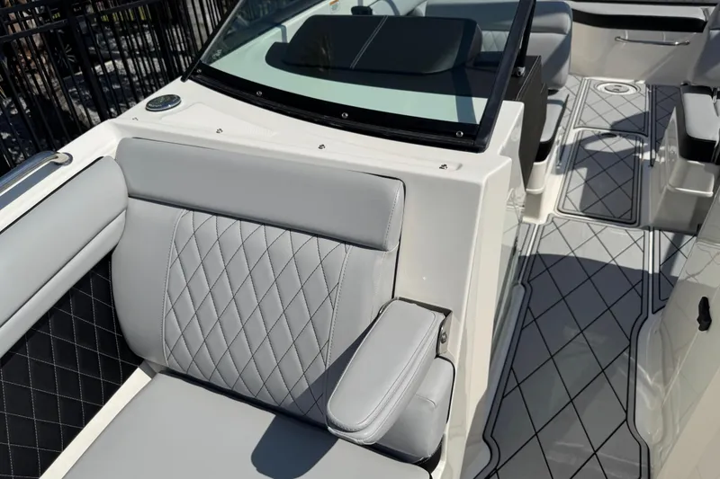 Slide: The Image of 2019 Sea Ray SDX 270 Outboard interior with gray quilted seating and sleek design. - 37