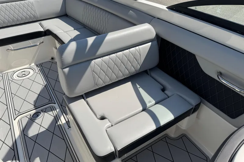 Slide: The Image of 2019 Sea Ray SDX 270 Outboard boat interior with luxurious seating and diamond-patterned upholstery. - 40