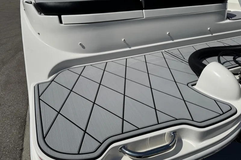 Slide: The Image of 2019 Sea Ray SDX 270 Outboard boat deck with sleek, modern design and textured surface. - 8