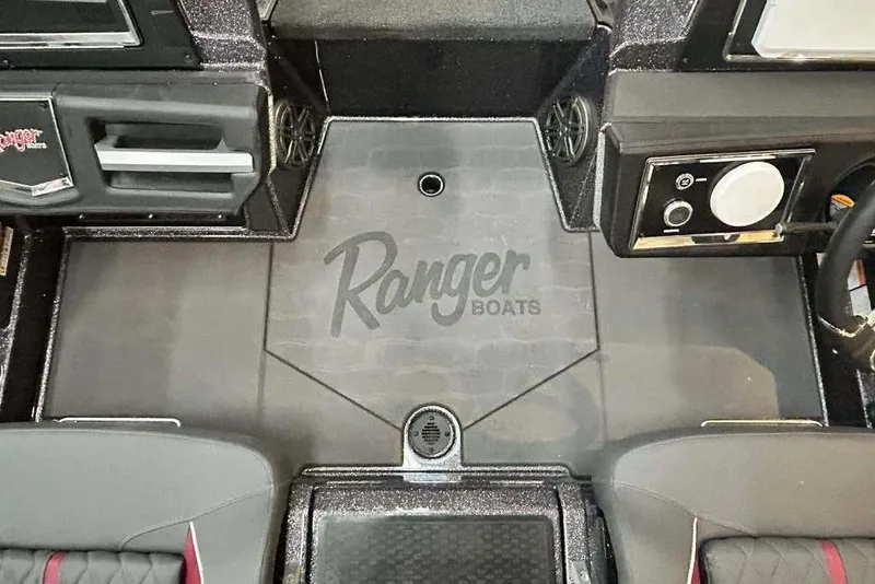 Slide: The Image of 2014 Ranger Z521R Cup-Equipped boat interior with logo and dashboard features. - 11