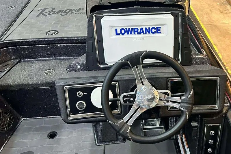Slide: The Image of 2014 Ranger Z521R Cup-Equipped boat dashboard with Lowrance GPS and steering wheel. - 4