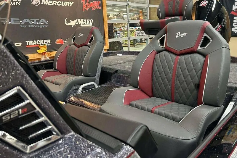 Slide: The Image of 2014 Ranger Z521R Cup-Equipped boat seats with quilted design and red accents. - 13