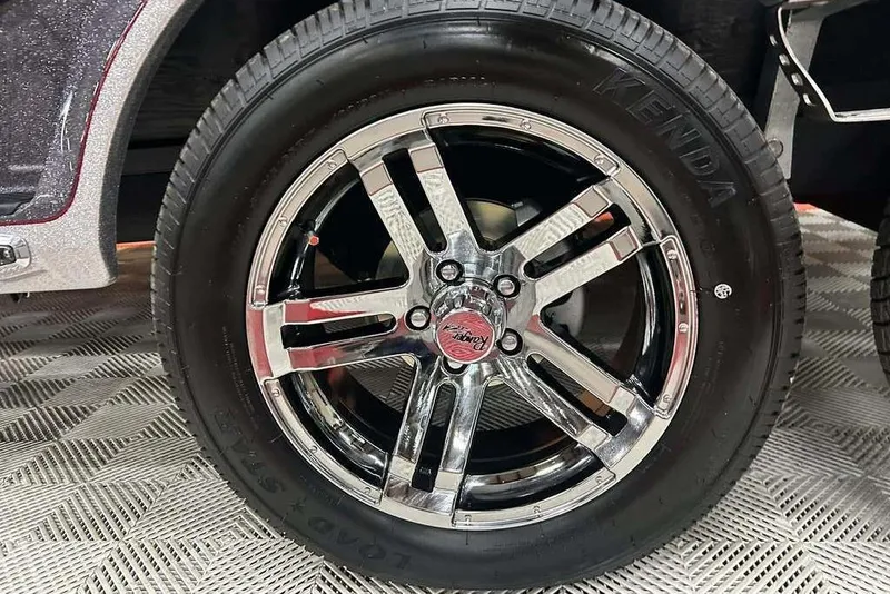 Slide: The Image of Chrome wheel of 2014 Ranger Z521R Cup-Equipped with Kenda tire on patterned floor. - 17