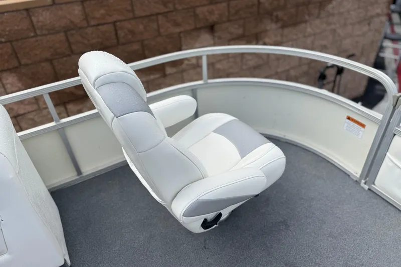Slide: The Image of White captain's chair on 2006 Bennington 2875RLTD I/O boat, with gray accents and railing. - 16