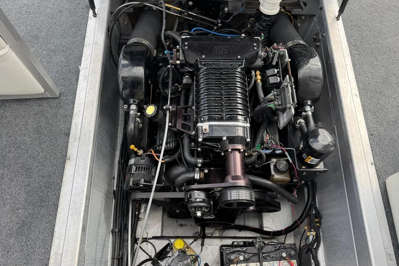 Slide: The Image of Engine compartment of a 2006 Bennington 2875RLTD I/O boat, showcasing detailed components. - 28