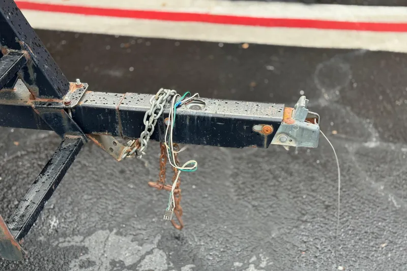 Slide: The Image of Rusty trailer hitch with chains and wires, Bennington 2875RLTD I/O, 2006 model. - 33