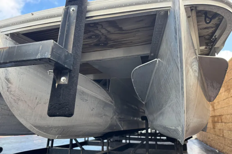 Slide: The Image of Underneath view of a 2006 Bennington 2875RLTD I/O pontoon boat on a trailer. - 4