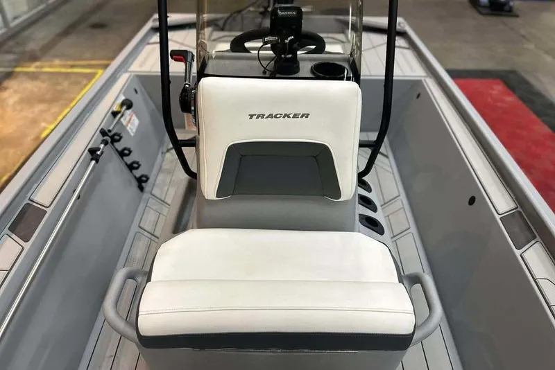 Slide: The Image of 2026 Tracker Bass Tracker Classic CC boat interior with steering console and seating. - 10