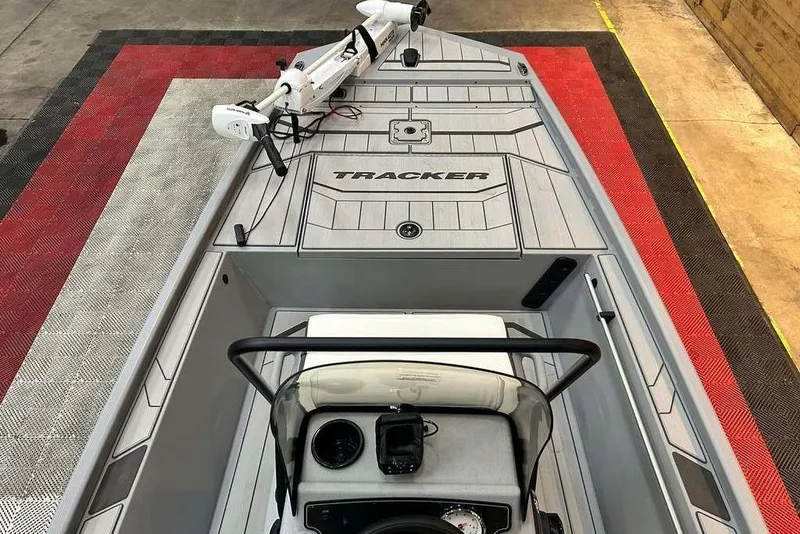 Slide: The Image of 2026 Tracker Bass Tracker Classic CC boat interior with steering console and trolling motor. - 9