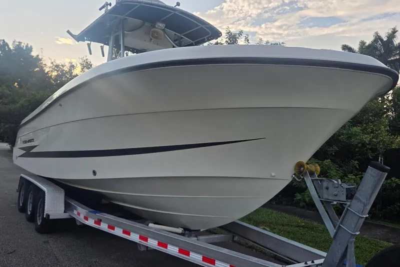 Slide: The Image of 2006 Hydra-Sports Vector 2500 CC boat on trailer, side view, outdoors. - 12