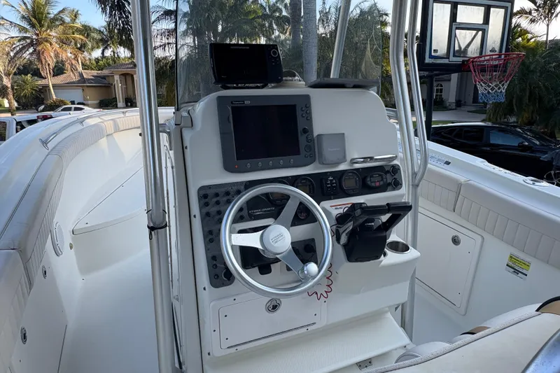 Slide: The Image of 2006 Hydra-Sports Vector 2500 CC boat cockpit with steering wheel and navigation equipment. - 15