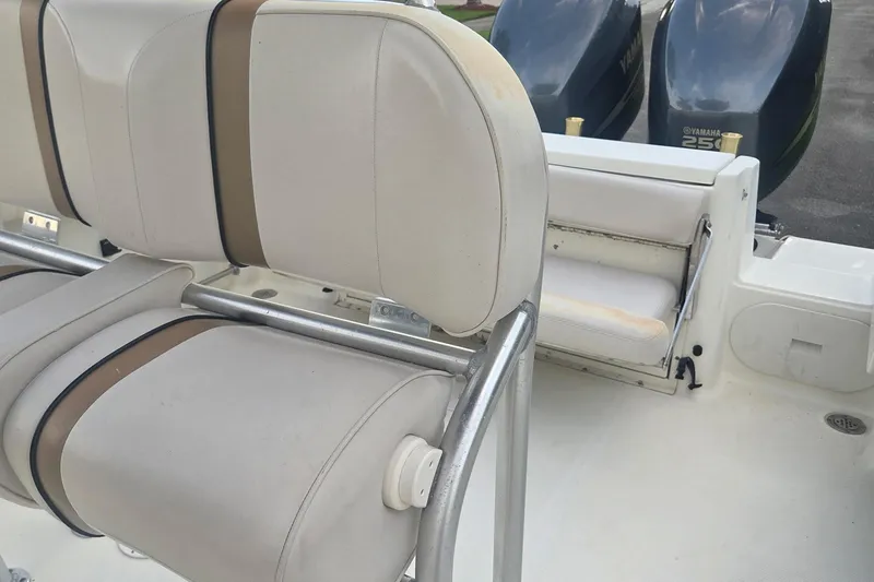 Slide: The Image of 2006 Hydra-Sports Vector 2500 CC boat interior with seating and dual Yamaha engines. - 17