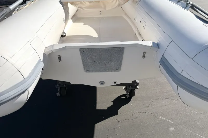 Slide: The Image of Inflatable boat interior, Caribe C10X 1999 model, on a sunny day. - 8