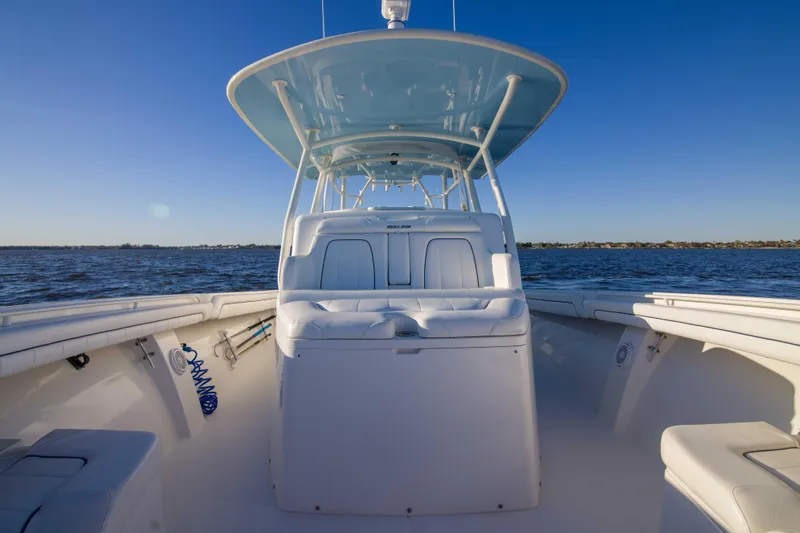 Slide: The Image of 2016 Regulator 41 boat on open water, featuring spacious seating and sleek design. - 12
