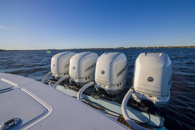 Slide: The Image of 2016 Regulator 41 boat with four Mercury outboard engines on open water. - 26