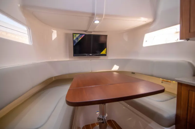 Slide: The Image of Luxurious interior of 2016 Regulator 41 boat with cozy seating and mounted TV. - 7