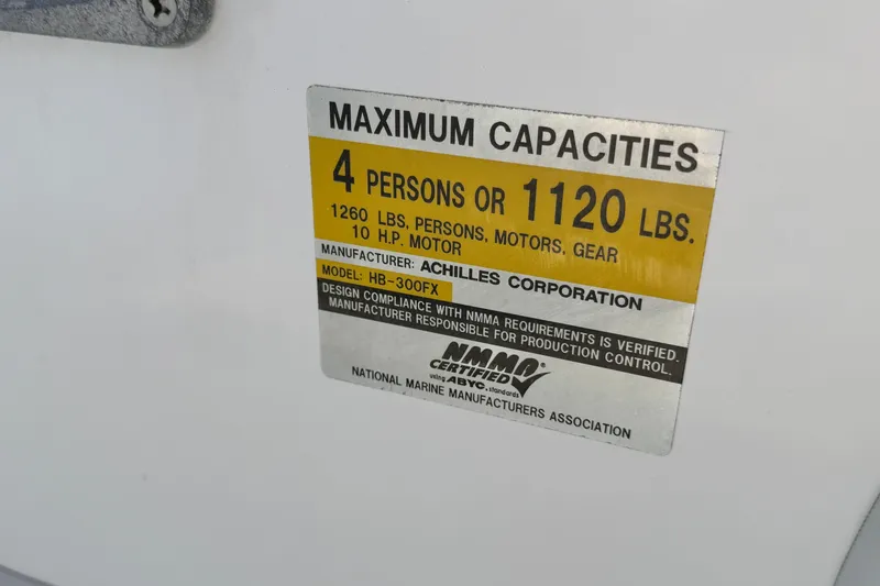 Slide: The Image of Capacity label for Achilles HB-300FX boat, 4 persons or 1120 lbs, NMMA certified. - 4