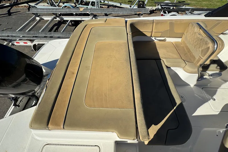 Slide: The Image of 2022 Bayliner VR6 Bowrider OB with tan seating and outboard motor. - 17