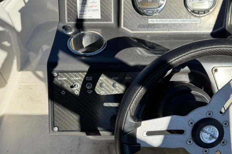 Slide: The Image of 2022 Bayliner VR6 Bowrider OB dashboard with steering wheel and control panel. - 29