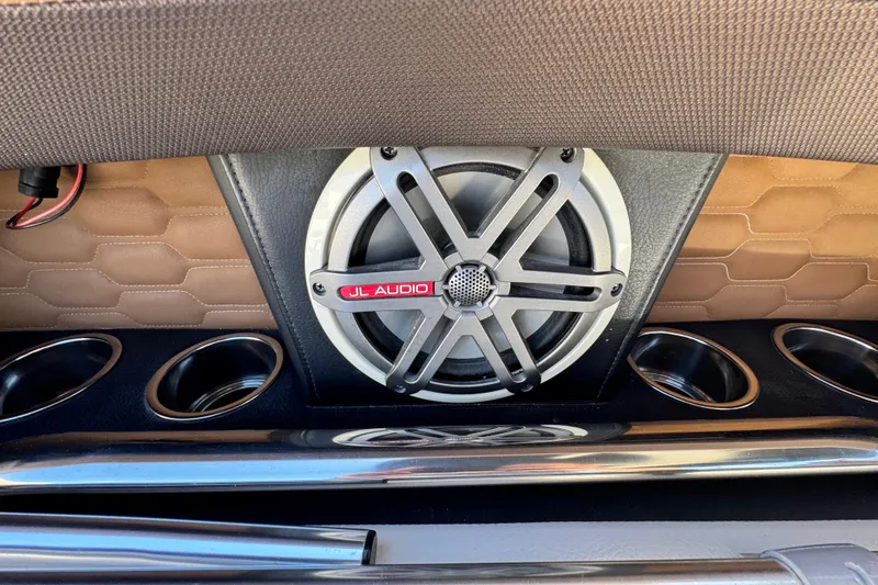 Slide: The Image of JL Audio speaker on 2018 Four Winns H290 OB boat with cup holders. - 37