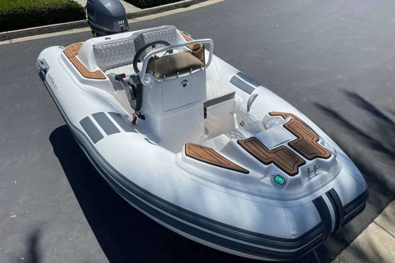 Slide: The Image of 2025 Caribe DL11 inflatable boat with sleek design and modern features. - 34