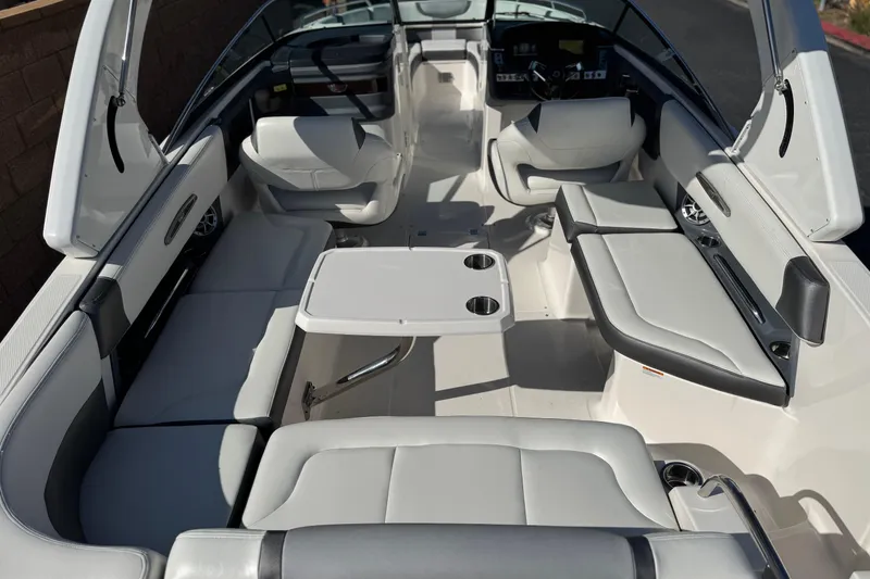 Slide: The Image of 2017 Chaparral 2870 SSX boat interior with seating and table setup. - 11