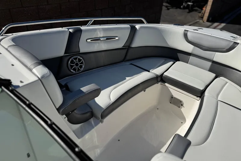 Slide: The Image of 2017 Chaparral 2870 SSX boat interior with cushioned seating and speaker. - 18