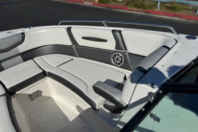 Slide: The Image of 2017 Chaparral 2870 SSX boat interior with white and gray seating. - 19