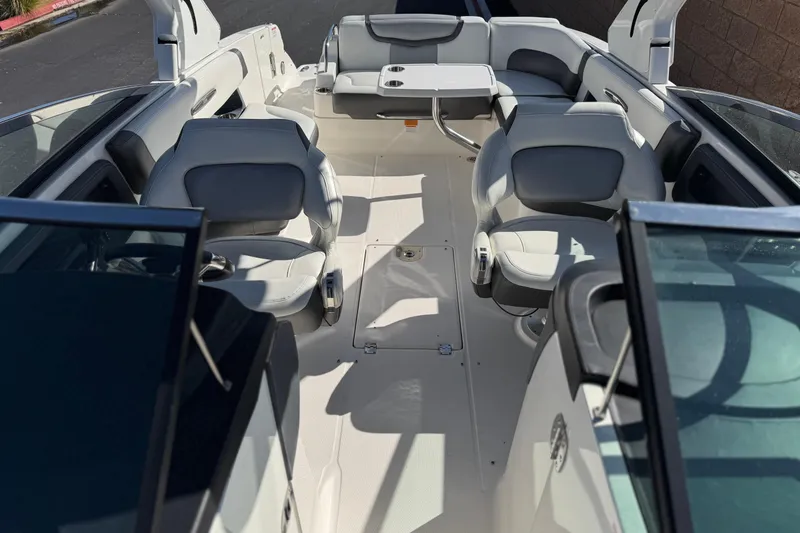 Slide: The Image of 2017 Chaparral 2870 SSX boat interior with seating and table, showcasing luxury design. - 24