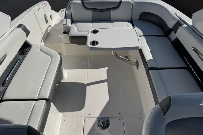 Slide: The Image of 2017 Chaparral 2870 SSX boat interior with seating and table, featuring sleek design. - 25