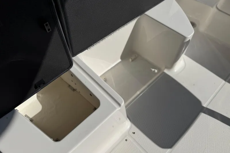Slide: The Image of Open storage compartments on a 2017 Chaparral 2870 SSX boat deck. - 26